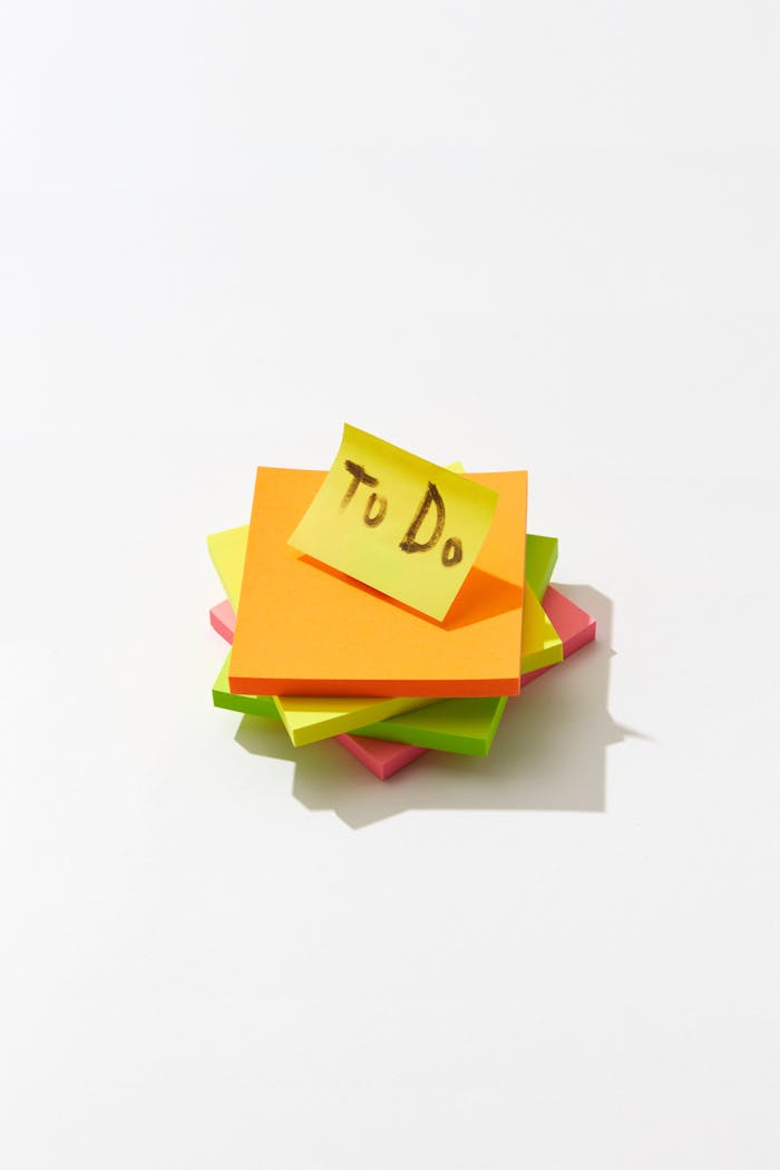 portfolio-03 Stack of colorful sticky notes with a 'To Do' note on top, isolated on white.